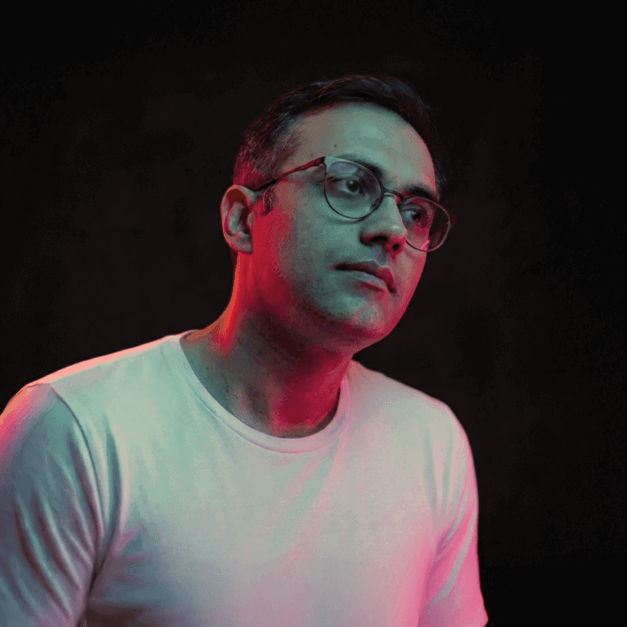 Portrait of Gui Batista in a clean, modern creative studio workspace